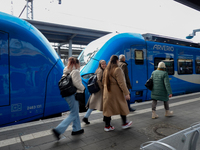 An Arverio train is stationed at Augsburg Central Station in Augsburg, Bavaria, Germany, on December 14, 2024, showcasing the vibrant blue d...