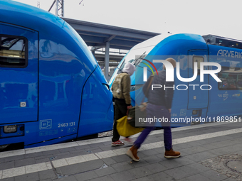 An Arverio train is stationed at Augsburg Central Station in Augsburg, Bavaria, Germany, on December 14, 2024, showcasing the vibrant blue d...