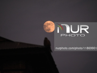 The final full moon, or cold moon, rises in Srinagar, Kashmir, on December 14, 2024. In India, reports indicate that there is no presence of...