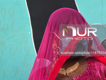 A participant attends the Rainbow Pride Walk, an event promoting gay, lesbian, bisexual, and transgender rights, in Kolkata, India, on Decem...