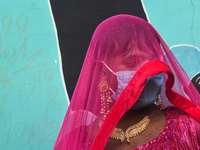 A participant attends the Rainbow Pride Walk, an event promoting gay, lesbian, bisexual, and transgender rights, in Kolkata, India, on Decem...