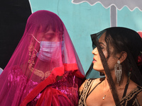 Participants attend the Rainbow Pride Walk, an event promoting gay, lesbian, bisexual, and transgender rights, in Kolkata, India, on Decembe...