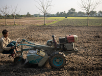 A farmer works in a field preparing to plant rice in Magura, Bangladesh, on December 15, 2024. The seasonal rice planting plays a crucial ro...