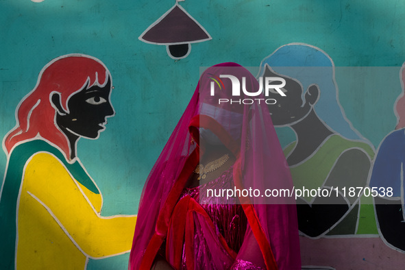 Participants from the LGBTQ+ community are seen dressed in various attire during the annual pride walk in Kolkata, India, on December 15, 20...