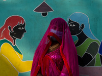 Participants from the LGBTQ+ community are seen dressed in various attire during the annual pride walk in Kolkata, India, on December 15, 20...