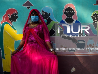 Participants from the LGBTQ+ community are seen dressed in various attire during the annual pride walk in Kolkata, India, on December 15, 20...