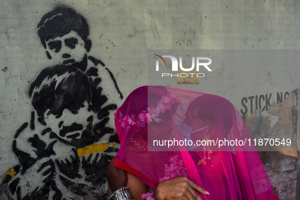 Participants from the LGBTQ+ community dress in various attire and hug each other during the annual pride walk in Kolkata, India, on Decembe...