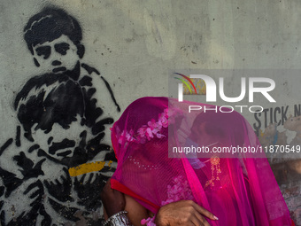 Participants from the LGBTQ+ community dress in various attire and hug each other during the annual pride walk in Kolkata, India, on Decembe...