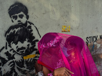 Participants from the LGBTQ+ community dress in various attire and hug each other during the annual pride walk in Kolkata, India, on Decembe...