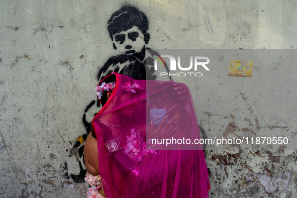 Participants from the LGBTQ+ community dress in various attire and hug each other during the annual pride walk in Kolkata, India, on Decembe...