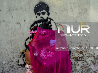 Participants from the LGBTQ+ community dress in various attire and hug each other during the annual pride walk in Kolkata, India, on Decembe...