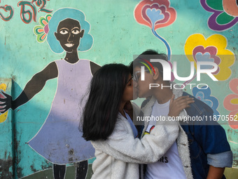 An LGBTQ+ couple kisses during the annual pride walk in Kolkata, India, on December 15, 2024. (