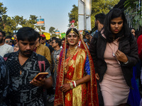 A trans man is seen dressed in traditional Bengali wedding attire during the annual pride walk in Kolkata, India, on December 15, 2024. (