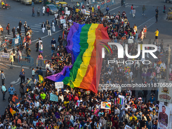 A giant pride flag is seen during the annual Pride walk in Kolkata, India, on December 15, 2024. (