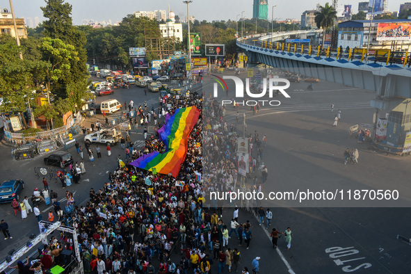 A giant pride flag is seen during the annual Pride walk in Kolkata, India, on December 15, 2024. 