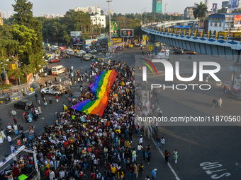 A giant pride flag is seen during the annual Pride walk in Kolkata, India, on December 15, 2024. (