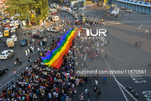 A giant pride flag is seen during the annual Pride walk in Kolkata, India, on December 15, 2024. 