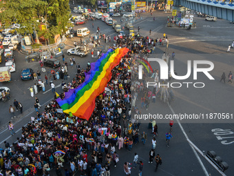 A giant pride flag is seen during the annual Pride walk in Kolkata, India, on December 15, 2024. (