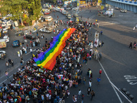 A giant pride flag is seen during the annual Pride walk in Kolkata, India, on December 15, 2024. (