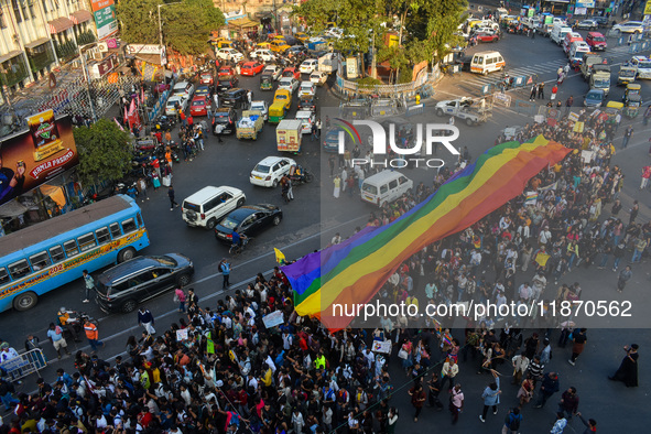 A giant pride flag is seen during the annual Pride walk in Kolkata, India, on December 15, 2024. 