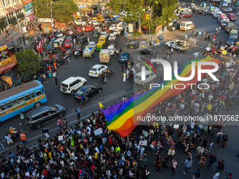 A giant pride flag is seen during the annual Pride walk in Kolkata, India, on December 15, 2024. (