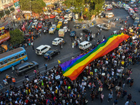 A giant pride flag is seen during the annual Pride walk in Kolkata, India, on December 15, 2024. (