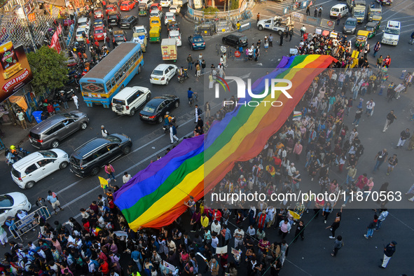 A giant pride flag is seen during the annual Pride walk in Kolkata, India, on December 15, 2024. 