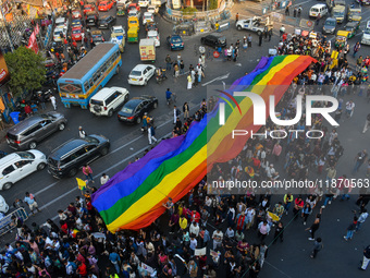 A giant pride flag is seen during the annual Pride walk in Kolkata, India, on December 15, 2024. (