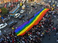 A giant pride flag is seen during the annual Pride walk in Kolkata, India, on December 15, 2024. (