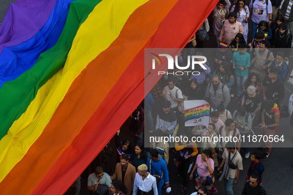 A giant pride flag is seen during the annual Pride walk in Kolkata, India, on December 15, 2024. 