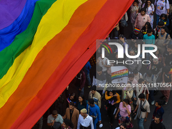 A giant pride flag is seen during the annual Pride walk in Kolkata, India, on December 15, 2024. (