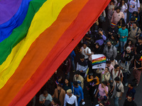 A giant pride flag is seen during the annual Pride walk in Kolkata, India, on December 15, 2024. (