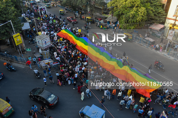 A giant pride flag is seen during the annual Pride walk in Kolkata, India, on December 15, 2024. 