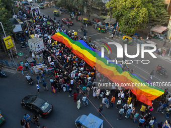 A giant pride flag is seen during the annual Pride walk in Kolkata, India, on December 15, 2024. (