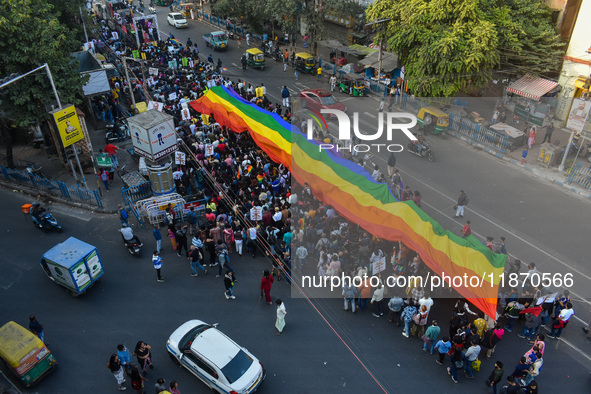 A giant pride flag is seen during the annual Pride walk in Kolkata, India, on December 15, 2024. 