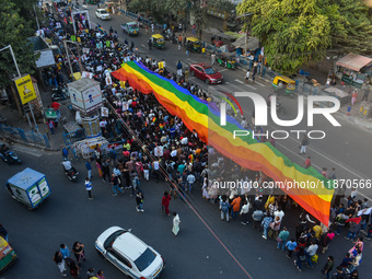 A giant pride flag is seen during the annual Pride walk in Kolkata, India, on December 15, 2024. (