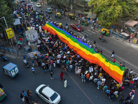 A giant pride flag is seen during the annual Pride walk in Kolkata, India, on December 15, 2024. (