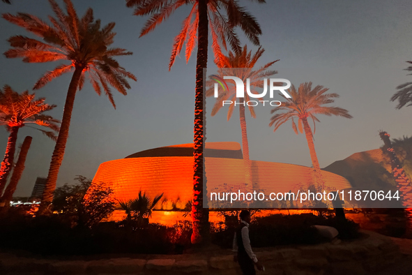 A worker walks past a building after sunset in Riyadh, Saudi Arabia on 03 March, 2024. 