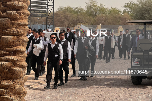 Migrant workers are seen arriving for work at an event near Riyadh, Saudi Arabia on 03 March, 2024. 