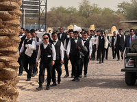 Migrant workers are seen arriving for work at an event near Riyadh, Saudi Arabia on 03 March, 2024. (