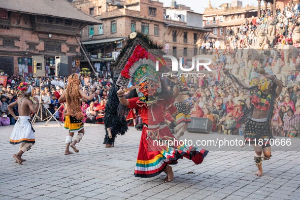 Masked dancers perform a traditional Newari dance during the Bhaktapur Mahotsav (Bhaktapur Street Festival) in Bhaktapur, Nepal, on Sunday. 