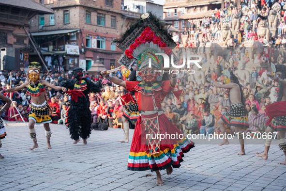 Masked dancers perform a traditional Newari dance during the Bhaktapur Mahotsav (Bhaktapur Street Festival) in Bhaktapur, Nepal, on Sunday. 