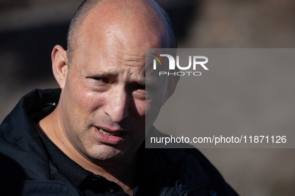 Former Israeli Prime Minister Naftali Bennett visits a lookout point next to the boundary fence delineating the UN-patrolled buffer zone bet...