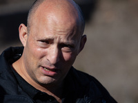 Former Israeli Prime Minister Naftali Bennett visits a lookout point next to the boundary fence delineating the UN-patrolled buffer zone bet...