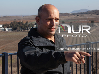 Former Israeli Prime Minister Naftali Bennett visits a lookout point next to the boundary fence delineating the UN-patrolled buffer zone bet...