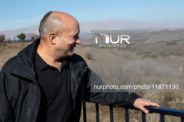 Former Israeli Prime Minister Naftali Bennett visits a lookout point next to the boundary fence delineating the UN-patrolled buffer zone bet...