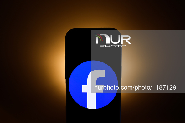 Facebook logo displayed on a phone screen is seen in this illustration photo taken in Poland on December 15, 2024. 