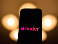 Tinder logo displayed on a phone screen is seen in this illustration photo taken in Poland on December 15, 2024. (