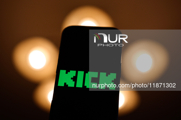 Kick logo displayed on a phone screen is seen in this illustration photo taken in Poland on December 15, 2024. 