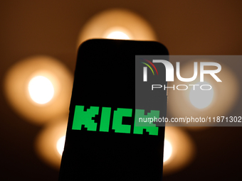 Kick logo displayed on a phone screen is seen in this illustration photo taken in Poland on December 15, 2024. (